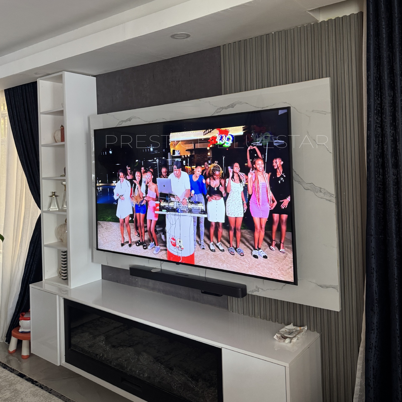Accessories That Elevate Your Living Room | Modern Design Ideas 1 Modern living room featuring a floating TV wall unit, marble feature wall, fluted panels, LED lighting